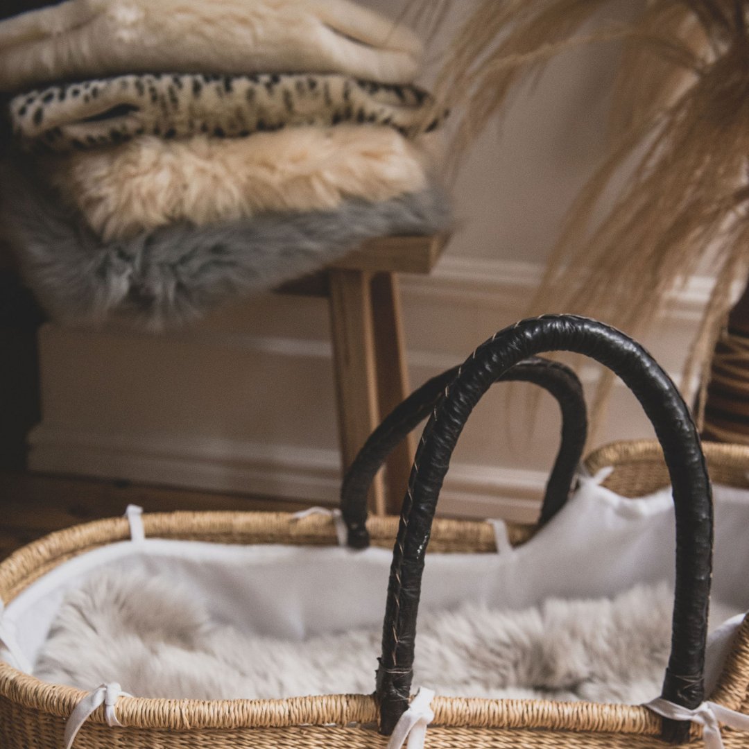 Baababy Sheepskin Pram Liner in a Moses Basket