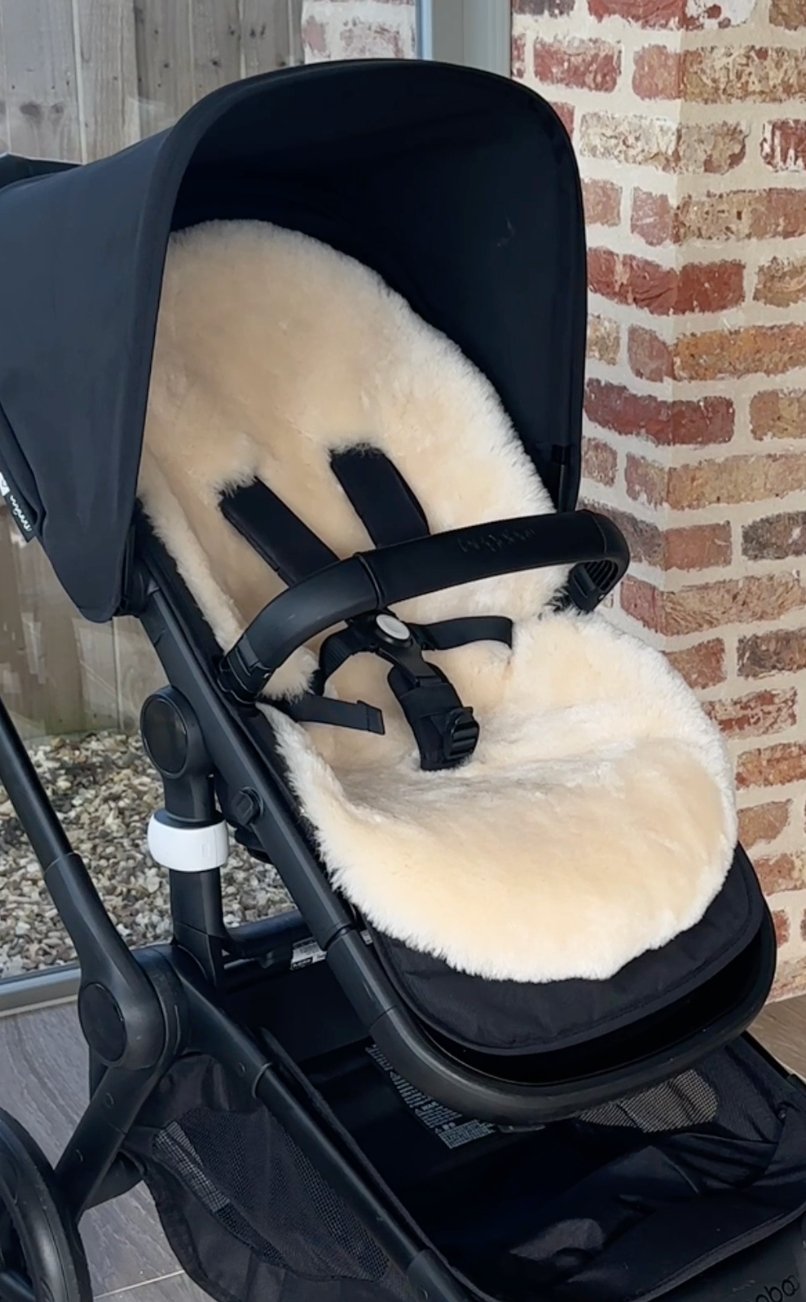 Sheepskin pram liner in a bugaboo fox 5 pram