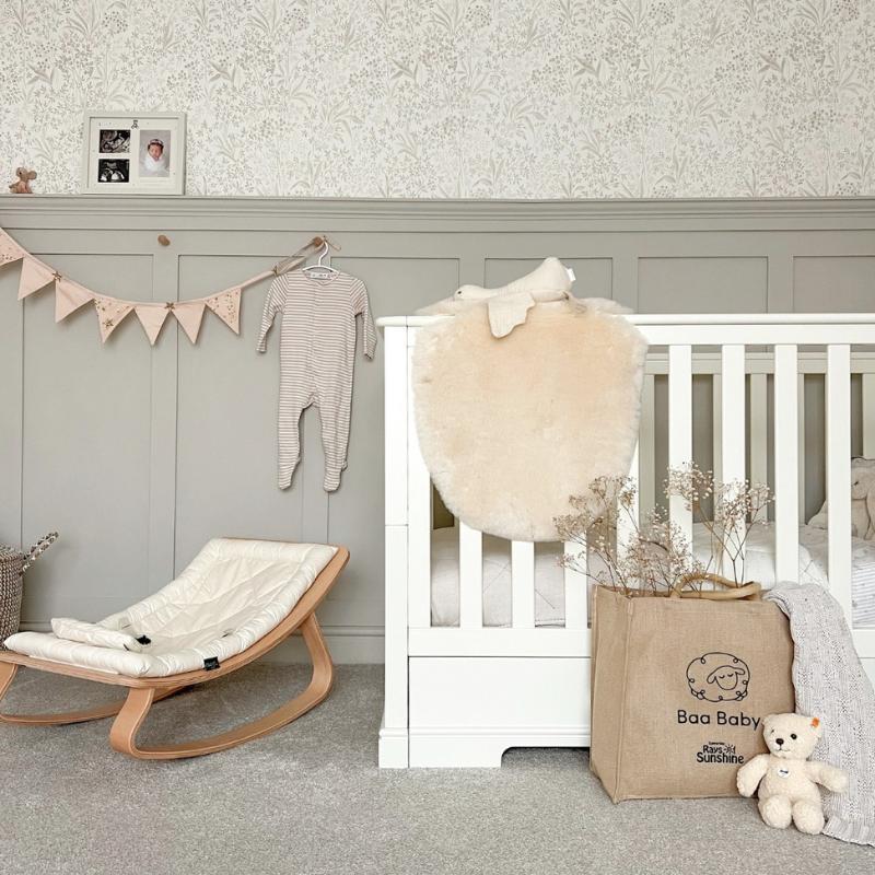 Sheepskin bassinet and carrycot liner for use in a moses basket, a baby safe sheepskin in a gender neutral white and milk for baby to sleep on