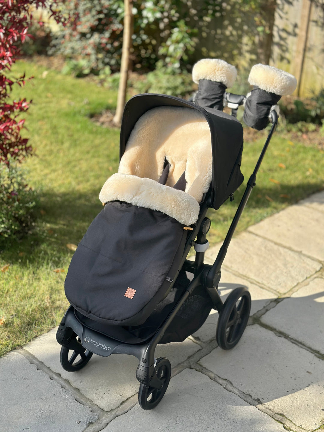 Bugaboo Fox 5 pram with a sheepskin  footmuff and matching buggy mittens lined with luxury milk lambskin