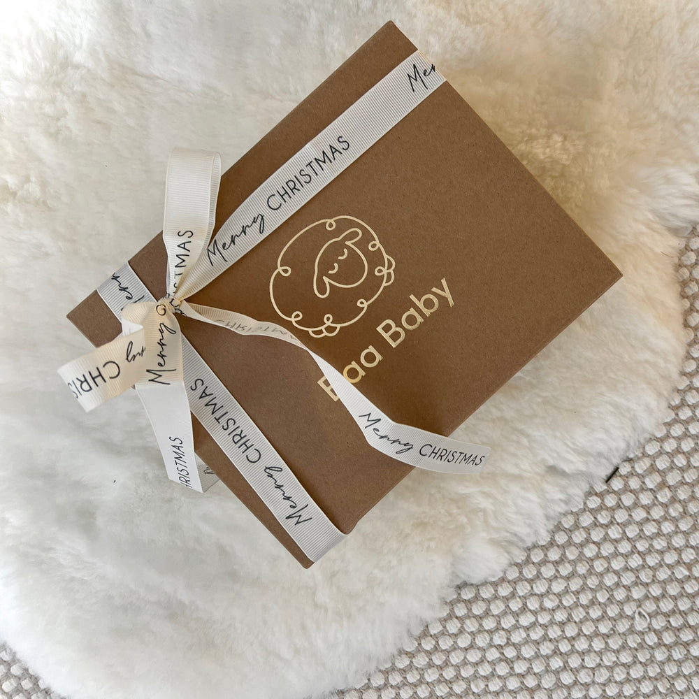 Baby and newborn christmas gift wrapped in luxury packaging