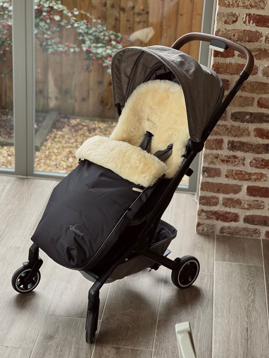 Sheepskin pram footmuff shown in the Joolz Aer Plus pram with a compact and neat fit and luxury and warmth for the winter month