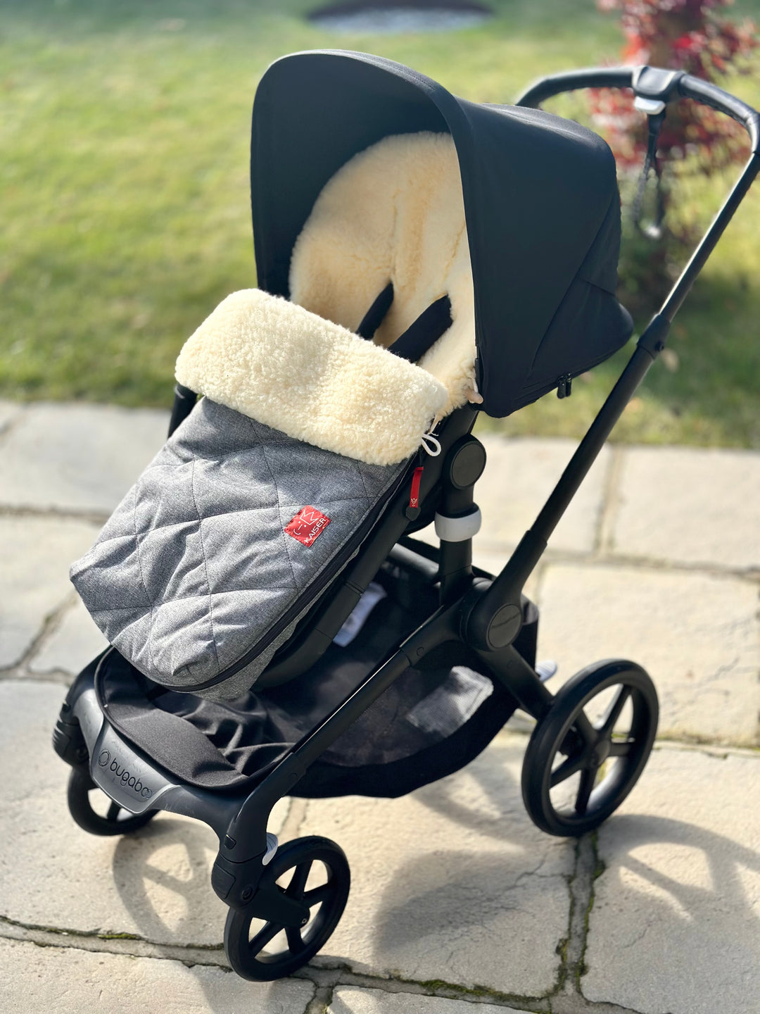 Sheepskin footmuff made by Kaiser shown in a black bugaboo fox 5