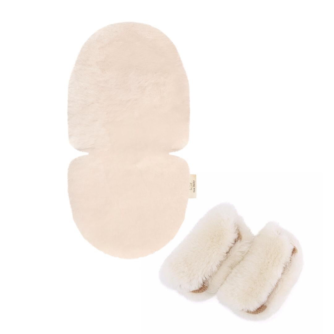 Sheepskin pram liner in milk to make the buggy comfortable for a baby with matching strap harness covers to stop the harness chafing and make them softer