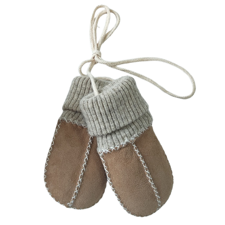 sock mittens for a baby or toddler with strings to keep safe and with a sock cuff made of merino.  Mittens are sheepskin lined with a suede outer and in a soft caramel brown and beige neutral shade