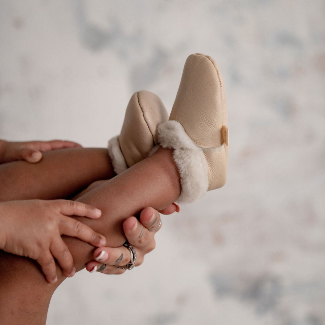 Neutral coloured lambskin booties for babies and toddlers hand crafted in New Zealand