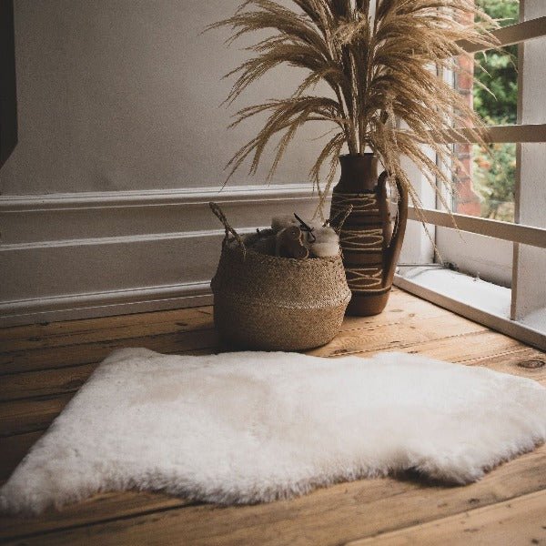 Lifestyle Shot of White Sheepskin Rug in Baby Nursery for Neutral Decor