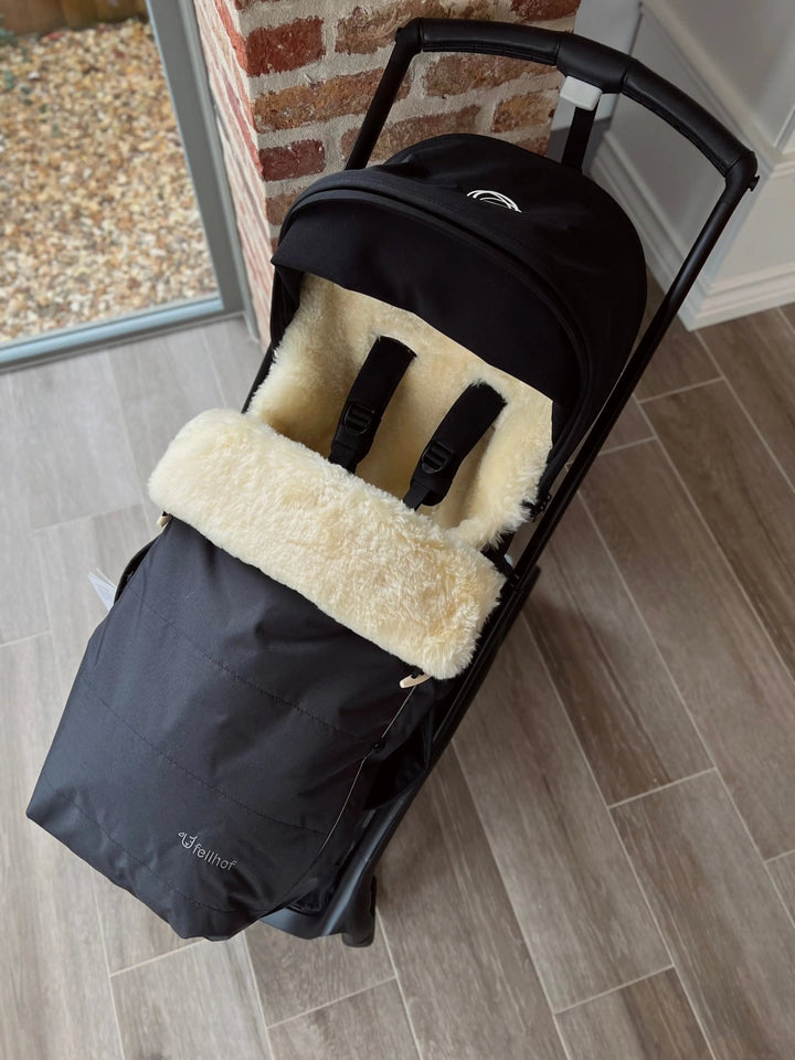 fellhof classic sheepskin footmuff in a bugaboo pram