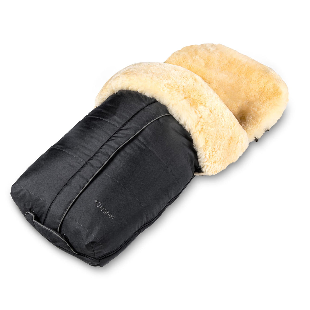 Fellhof premium sheepskin pram footmuff in black with merino honey lining.  Top zips off to leave a pram liner for warmer months