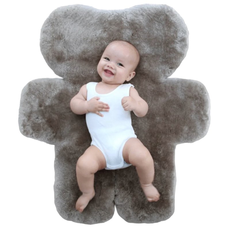 Baby Laying on Australian Sustainable Sheepskin FLATOUT Bear Rug in Brown Latte for tummy time or sleep