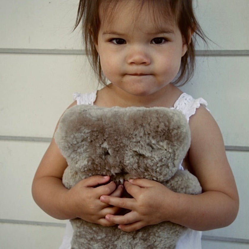 Girl Holding FLATOUT Big Bear in Latte for Cuddling and Easy Grip