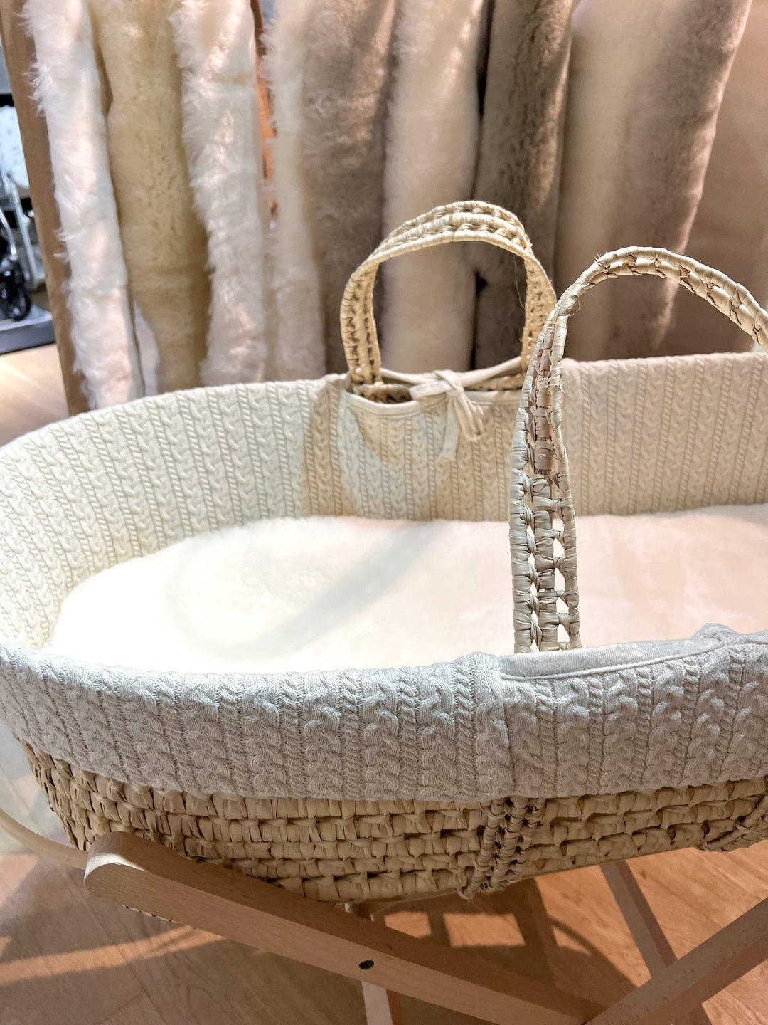 Sheepskin moses basket and carrycot liner placed in a natural basket to help a baby sleep