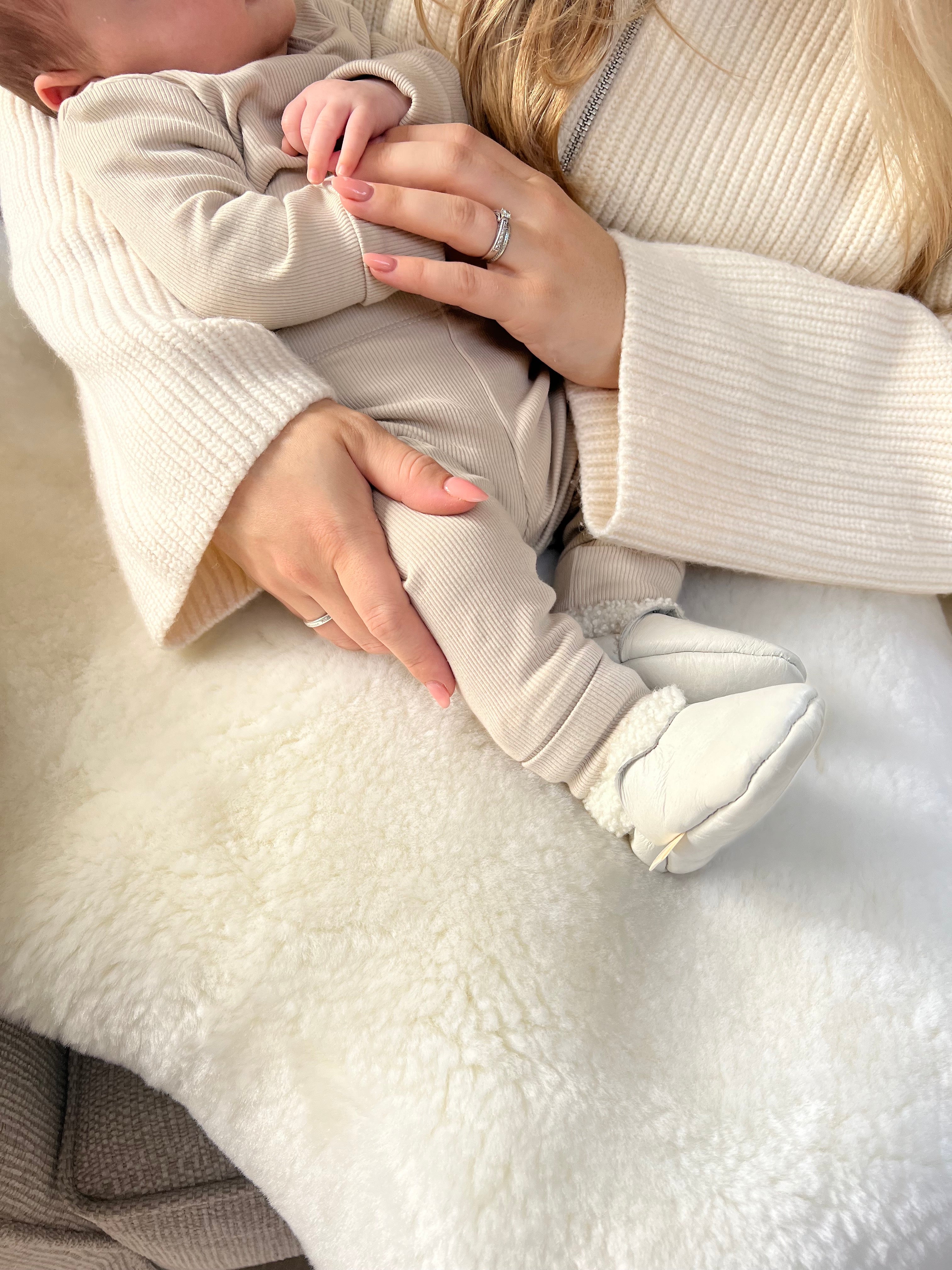 newborn with soft soled natural and sustainable baby booties