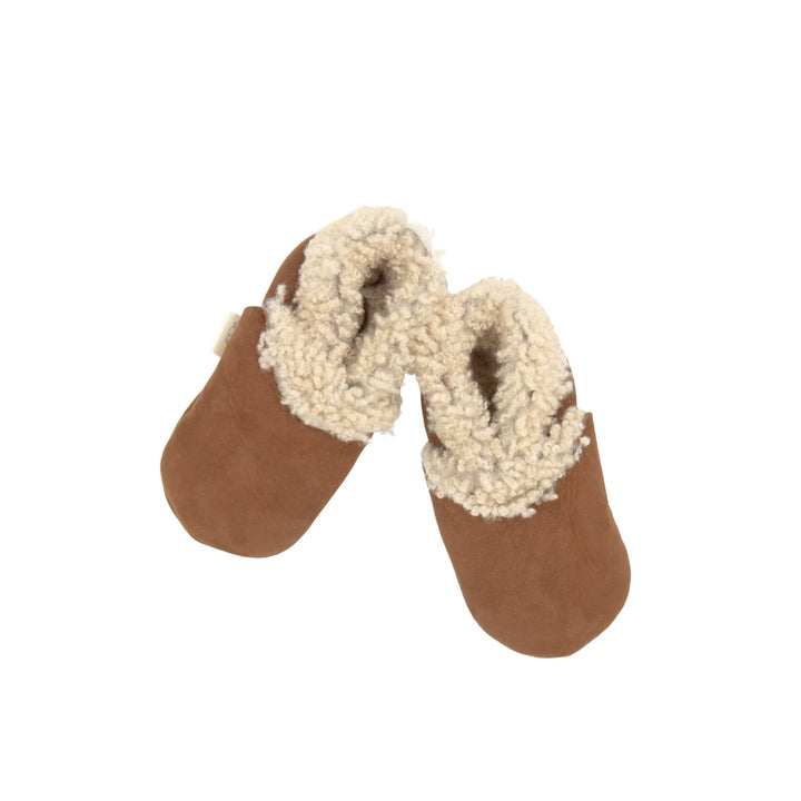 tan lambskin booties with soft soles safe for newborns