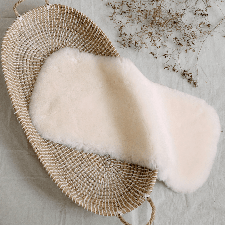 Baa Baby bassinet liner in a creamy milk colour
