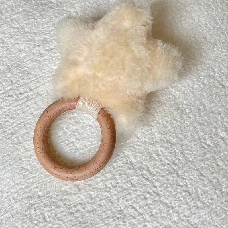 Baby rattle- sheepskin star-wooden handle