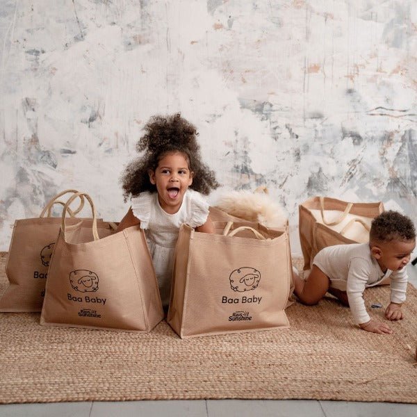 baby safe sheepskin rug and pram liner in a cotton and jute premium shopper bag