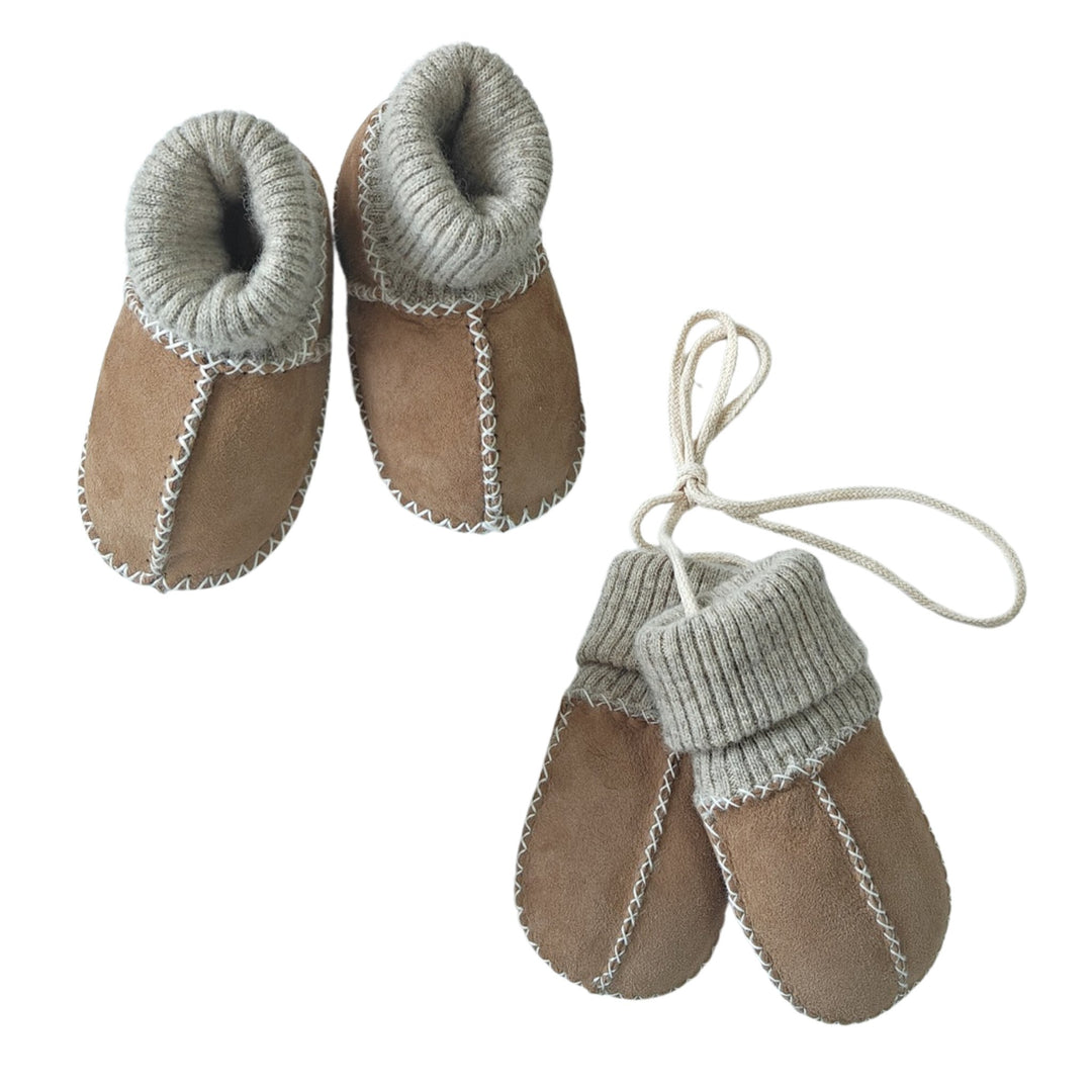 Matching set of luxury sheepskin baby booties and mittens in neutral shades.  Designed to stay on hands and feet with a sock cuff and puddy mittens on string for toddlers