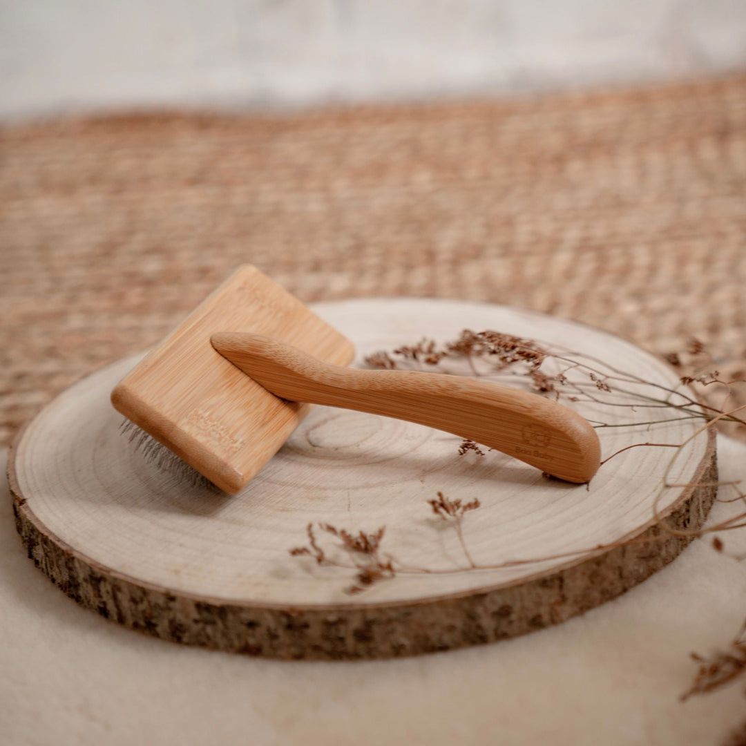 Sheepskin slicker brush for smoothing lambskin and keeping the fleece soft and fluffy